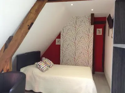 Un ou plusieurs lits dans un hébergement de l'établissement Chambre d'hôte du HOUSSAY à VALENNES 72320