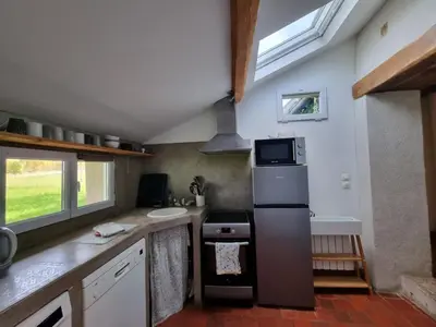 Cuisine ou kitchenette dans l'établissement Gîte