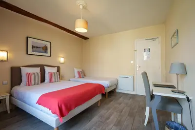 Un ou plusieurs lits dans un hébergement de l'établissement Hotel Val De Loire