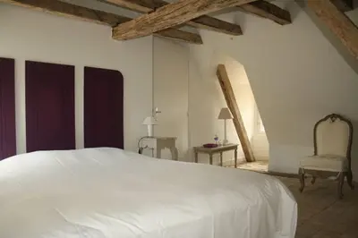 Un ou plusieurs lits dans un hébergement de l'établissement Manoir - Gîte avec Spa pour 10 p.