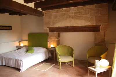 Un ou plusieurs lits dans un hébergement de l'établissement Manoir - Gîte avec Spa pour 10 p.
