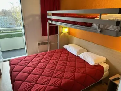 Un ou plusieurs lits dans un hébergement de l'établissement Premiere Classe Blois Nord