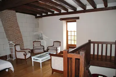 Coin salon dans l'établissement Gîte Au près du Lys
