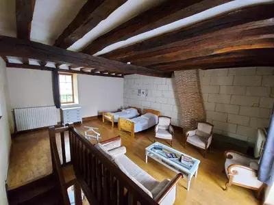 Coin salon dans l'établissement Gîte Au près du Lys