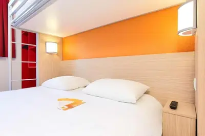 Un ou plusieurs lits dans un hébergement de l'établissement Premiere Classe Tours Sud - Joue Les Tours