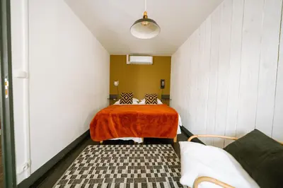 Un ou plusieurs lits dans un hébergement de l'établissement Maison Gaspard - Suites et appartements de charme à Saumur