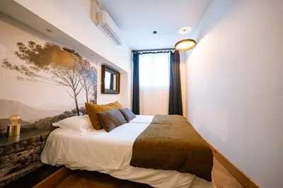 Un ou plusieurs lits dans un hébergement de l'établissement Maison Gaspard - Suites et appartements de charme à Saumur