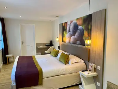 Un ou plusieurs lits dans un hébergement de l'établissement Best Western Hôtel De France