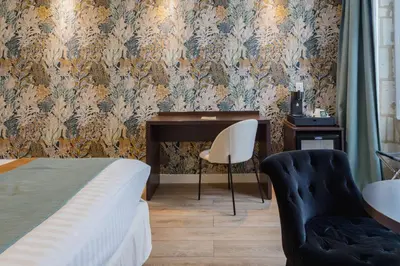 Un ou plusieurs lits dans un hébergement de l'établissement Best Western Hôtel De France