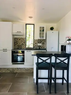 Cuisine ou kitchenette dans l'établissement COTTAGE A LA FONTAINE DU CHENE