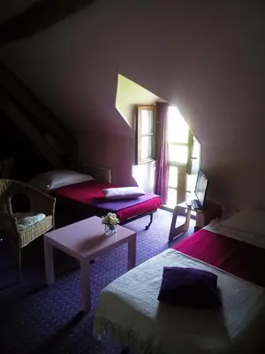 Un ou plusieurs lits dans un hébergement de l'établissement Le Clos de Châtres