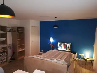 Un ou plusieurs lits dans un hébergement de l'établissement Cosmopolitan & Parking, Centre ville Le Mans