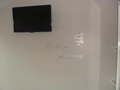 Télévision ou salle de divertissement dans l'établissement Chambres d'hôtes Sébastien