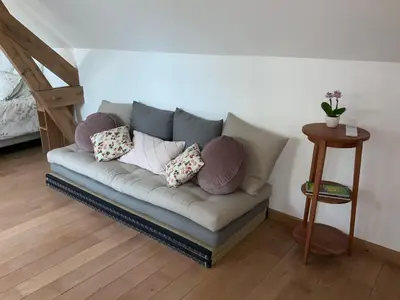 Coin salon dans l'établissement Le Gite du Chemin Vert