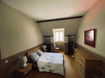 Un ou plusieurs lits dans un hébergement de l'établissement Gîte la Pahèserie