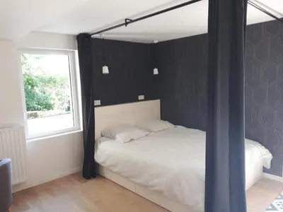 Un ou plusieurs lits dans un hébergement de l'établissement Appartement Pierres de Loire- Linge inclus -1er étage