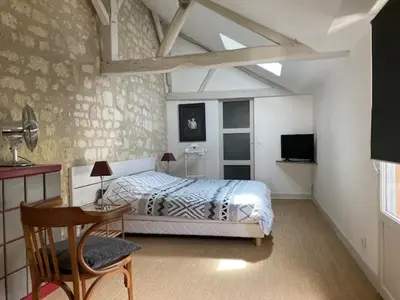 Un ou plusieurs lits dans un hébergement de l'établissement Chambres d'Hôtes Rue du Poids