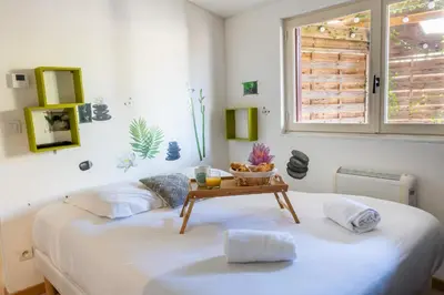 Un ou plusieurs lits dans un hébergement de l'établissement Cocooning Place