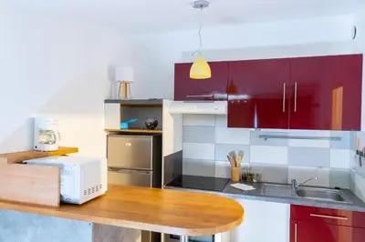 Cuisine ou kitchenette dans l'établissement Cocooning Place