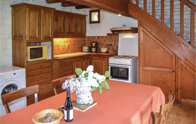 Cuisine ou kitchenette dans l'établissement Le Clos Des Tilleuls