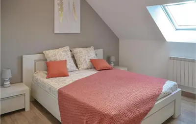 Un ou plusieurs lits dans un hébergement de l'établissement Nice Home In Thilouze