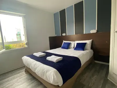 Un ou plusieurs lits dans un hébergement de l'établissement Fasthotel Tours Nord