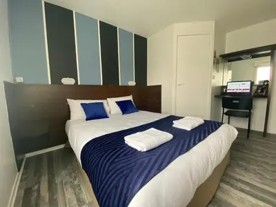 Un ou plusieurs lits dans un hébergement de l'établissement Fasthotel Tours Nord