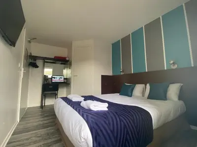 Un ou plusieurs lits dans un hébergement de l'établissement Fasthotel Tours Nord