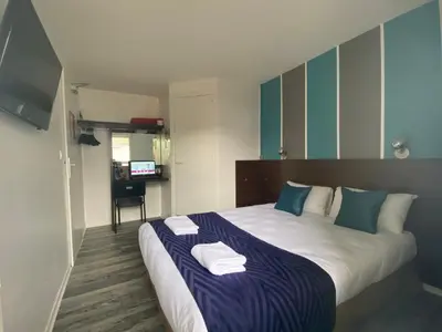 Un ou plusieurs lits dans un hébergement de l'établissement Fasthotel Tours Nord