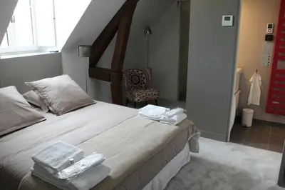 Un ou plusieurs lits dans un hébergement de l'établissement Les Suites du Château de Cheverny