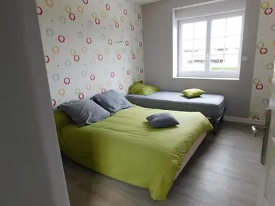Un ou plusieurs lits dans un hébergement de l'établissement Maison accueillante à Mouterre-Silly avec jardin et cheminée