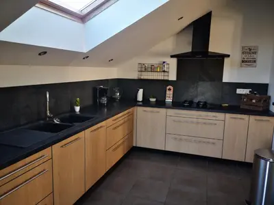 Cuisine ou kitchenette dans l'établissement maison du bonheur de la basse biguerie proche du zoo de la flèche