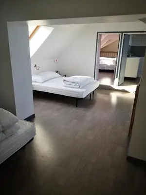 Un ou plusieurs lits dans un hébergement de l'établissement maison du bonheur de la basse biguerie proche du zoo de la flèche