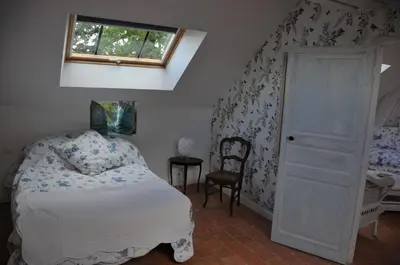 Un ou plusieurs lits dans un hébergement de l'établissement L'Orangerie du Château - LE NID - GITE 2 Personnes