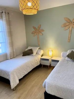 Un ou plusieurs lits dans un hébergement de l'établissement Gîte Hibiscus