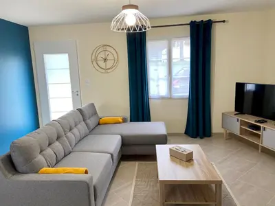 Télévision ou salle de divertissement dans l'établissement Gîte Hibiscus