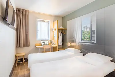Un ou plusieurs lits dans un hébergement de l'établissement B&B HOTEL Tours Nord 2 La petite Arche