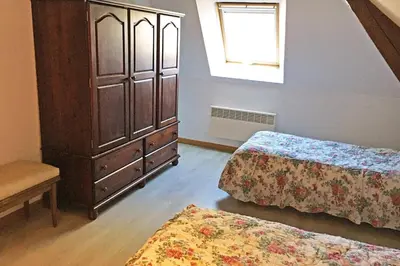 Un ou plusieurs lits dans un hébergement de l'établissement Appartement du Commun au Château de Chanteloup