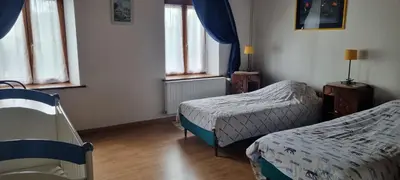 Un ou plusieurs lits dans un hébergement de l'établissement Grand gîte à la campagne