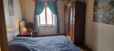 Un ou plusieurs lits dans un hébergement de l'établissement Grand gîte à la campagne
