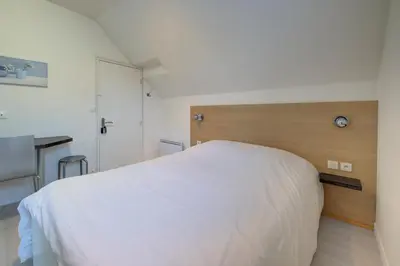 Un ou plusieurs lits dans un hébergement de l'établissement La petite maison 3