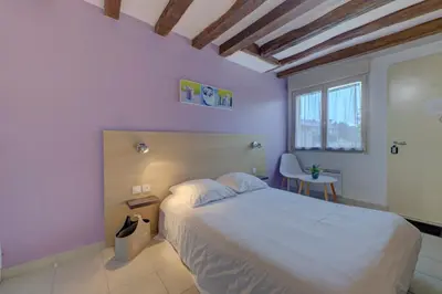 Un ou plusieurs lits dans un hébergement de l'établissement La petite maison 4