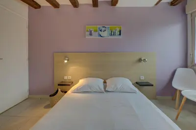 Un ou plusieurs lits dans un hébergement de l'établissement La petite maison 4