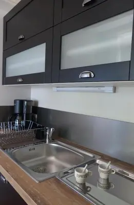 Cuisine ou kitchenette dans l'établissement Pergoloire