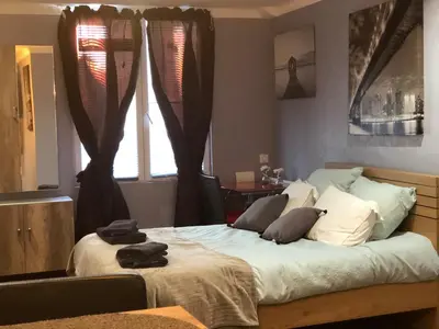 Un ou plusieurs lits dans un hébergement de l'établissement Studio Chaleureux Blois Centre
