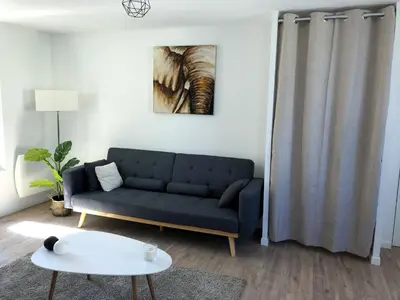 Coin salon dans l'établissement Une parenthèse de confort à proximité du centre