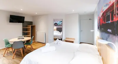 Un ou plusieurs lits dans un hébergement de l'établissement Malicorn' Appart-Hôtel