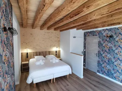 Un ou plusieurs lits dans un hébergement de l'établissement Malicorn' Appart-Hôtel