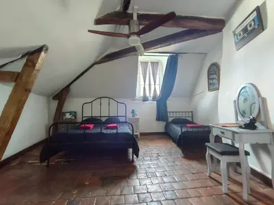 Un ou plusieurs lits dans un hébergement de l'établissement Au pied du château