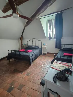 Un ou plusieurs lits dans un hébergement de l'établissement Au pied du château